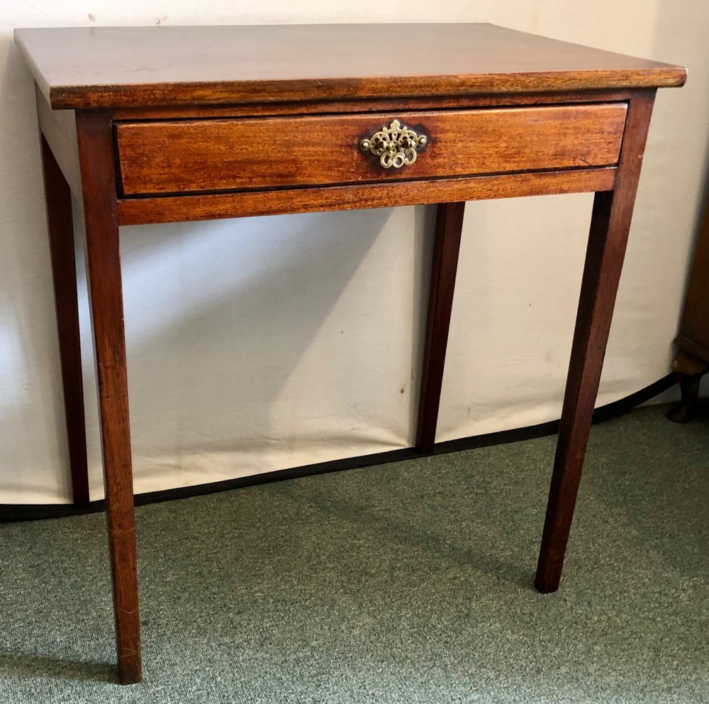A small George III mahogany side table featuring a single frieze drawer, brass backplate handle, and four straight legs. View IV