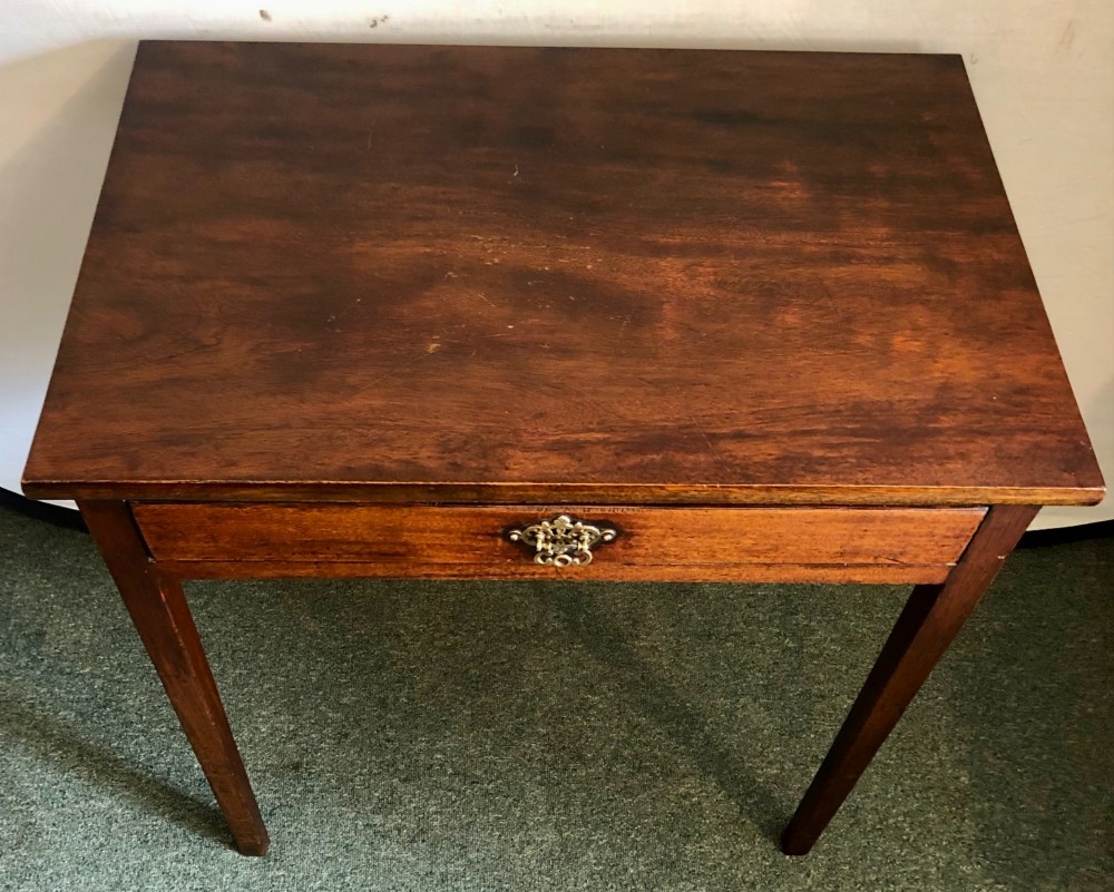 A small George III mahogany side table featuring a single frieze drawer, brass backplate handle, and four straight legs. View V