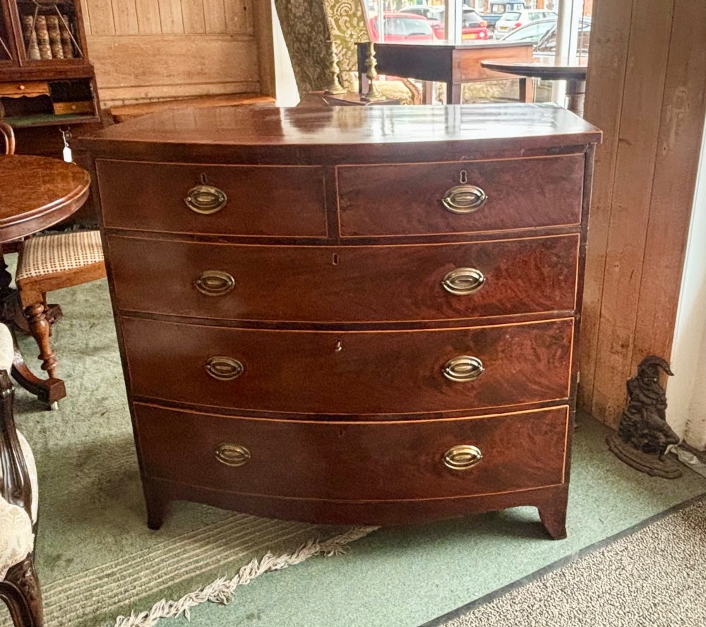 Regency mahogany and cross-banded bow front chest of drawers View VI
