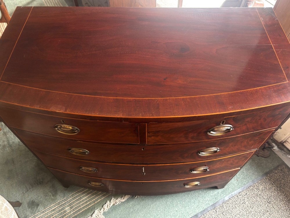 Regency mahogany and cross-banded bow front chest of drawers View IX