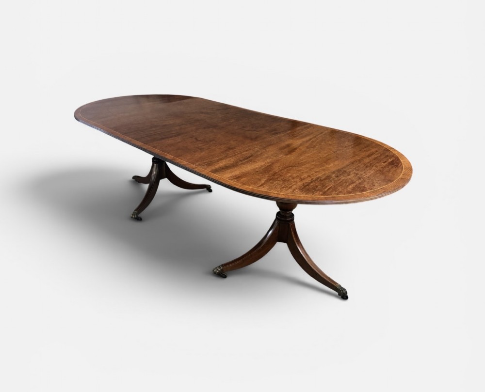 Regency design figured mahogany twin pillar dining table