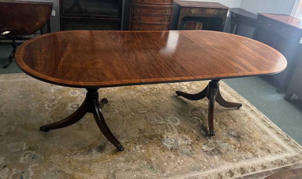 Regency design figured mahogany twin pillar dining table View IV