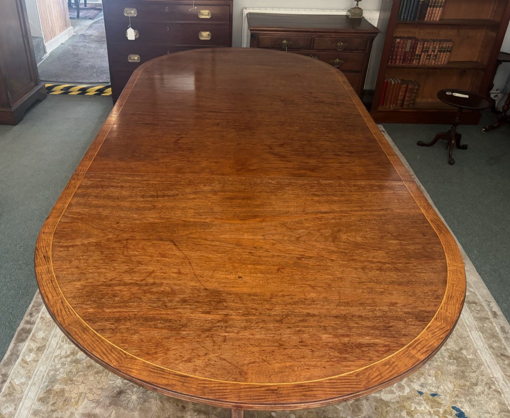 Regency design figured mahogany twin pillar dining table View VI