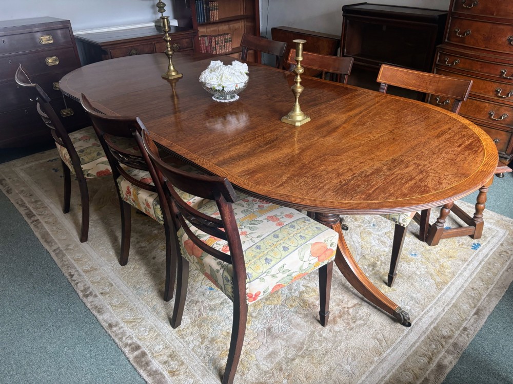 Regency design figured mahogany twin pillar dining table View VII