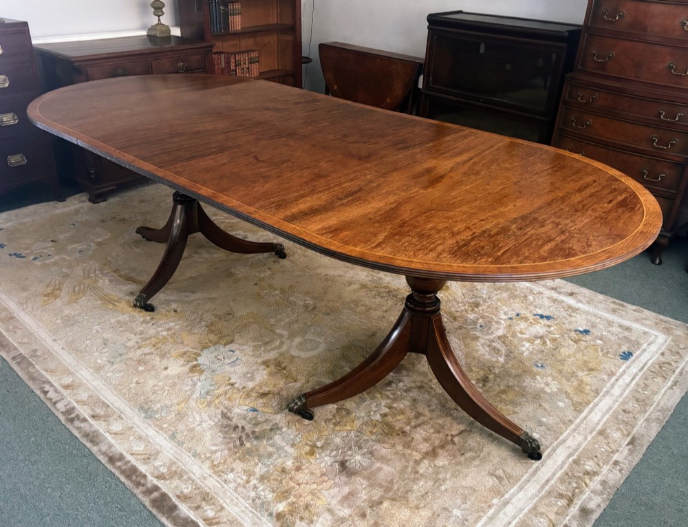 Regency design figured mahogany twin pillar dining table View VIII