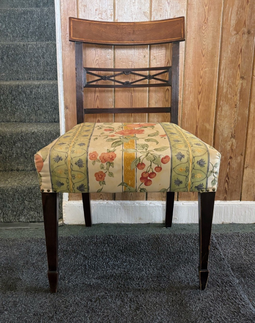 A set of six early nineteenth century mahogany dining chairs featuring tablet top rails, reeded frames, lattice splats, and floral striped fabric seats. View VII