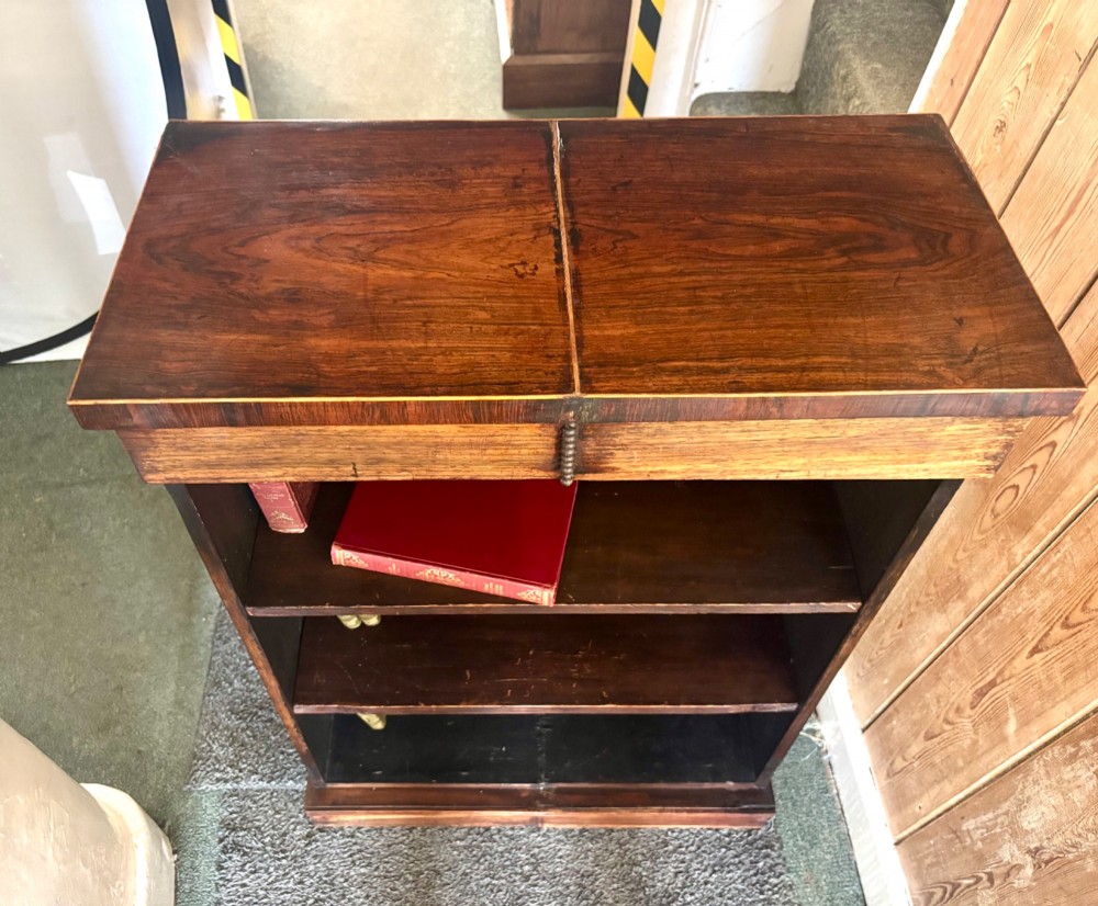 A small 19th-century rosewood open bookcase featuring three internal storage shelves and a solid plinth base. View IV