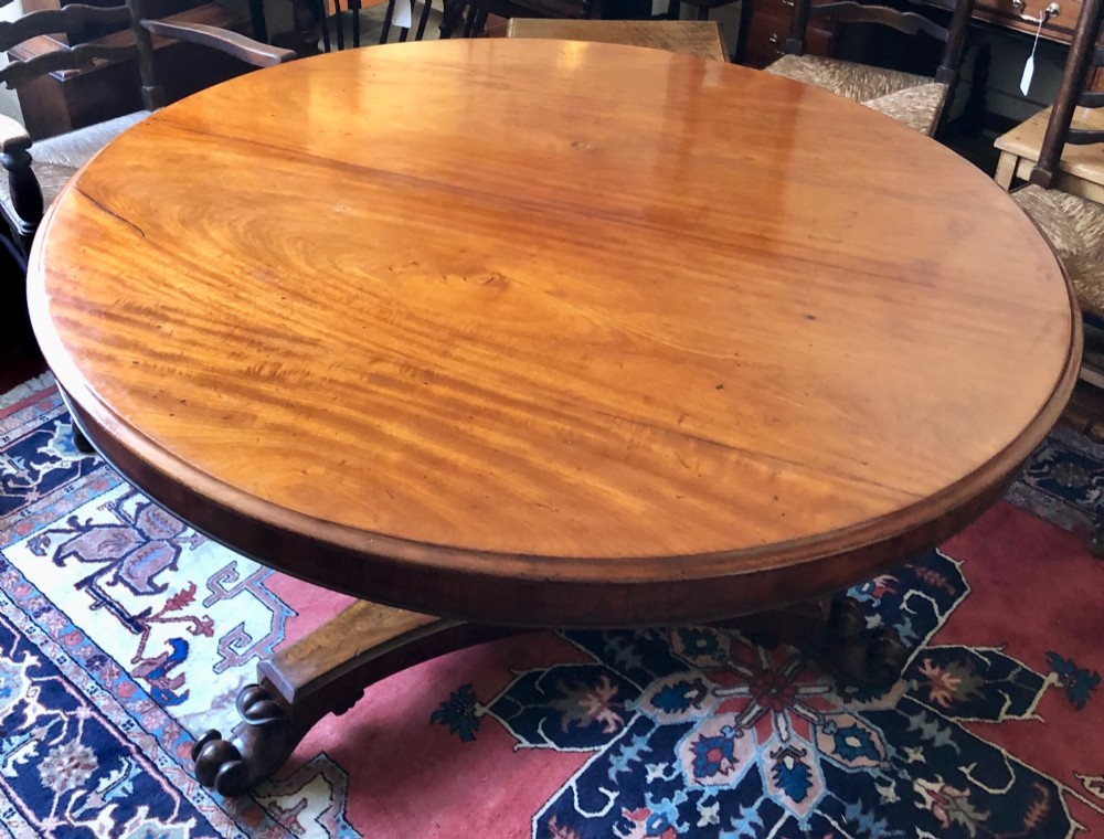Large Regency figured mahogany tilt top round dining table View III