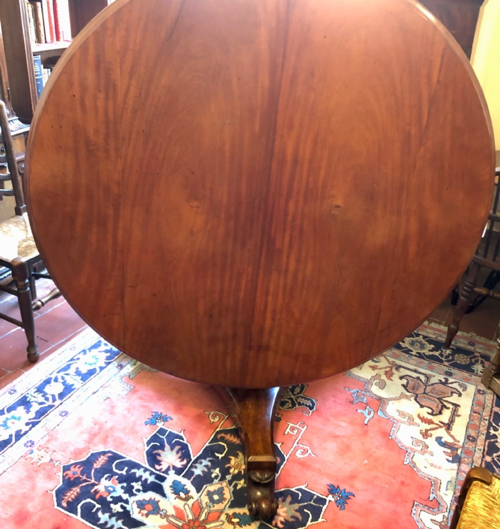 Large Regency figured mahogany tilt top round dining table View V