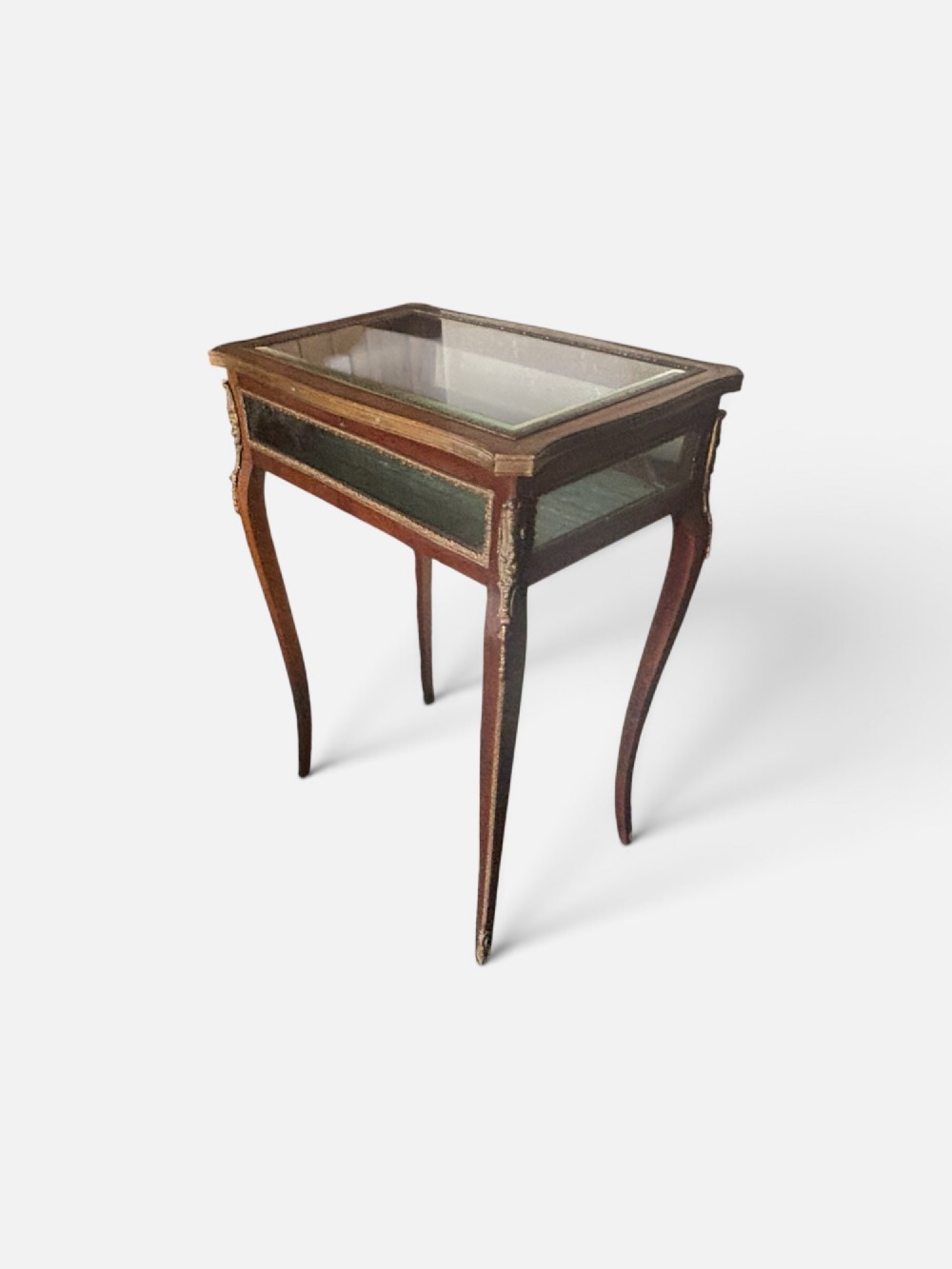 A 19th-century walnut vitrine display table featuring glass side panels, decorative metal mounts, and slender cabriole legs. View II