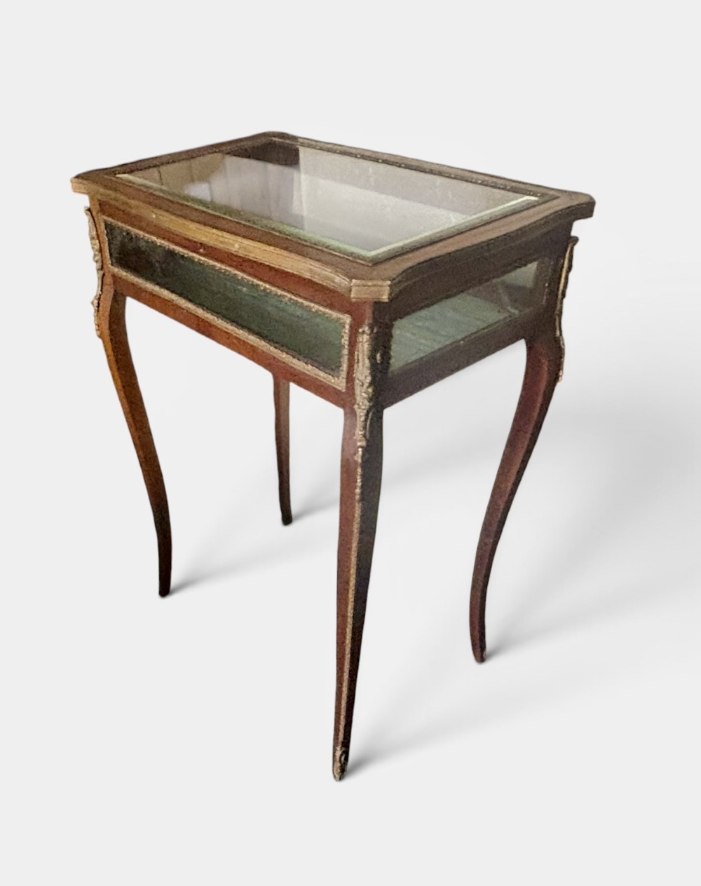 A 19th-century walnut vitrine display table featuring glass side panels, decorative metal mounts, and slender cabriole legs. View III