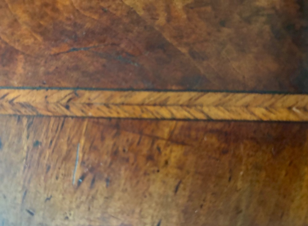 A George III walnut lowboy featuring a crossbanded top, a drawer with brass handles, and slender cabriole legs terminating in pad feet. View VIII