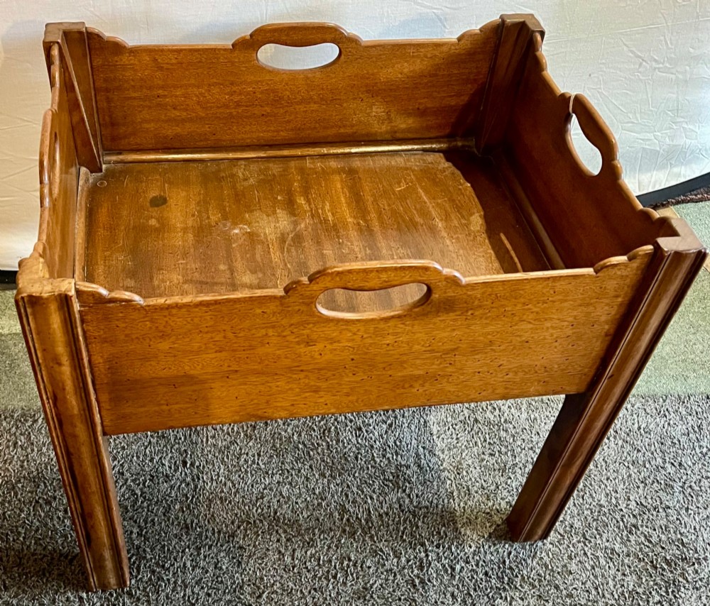 An early 20th-century mahogany low table featuring a raised gallery rim with integrated hand-holds and reeded square legs. View II