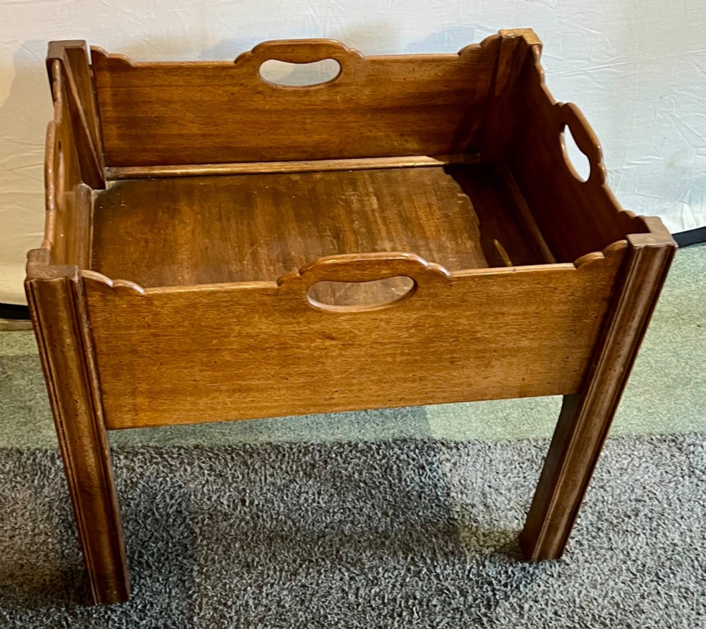 An early 20th-century mahogany low table featuring a raised gallery rim with integrated hand-holds and reeded square legs. View III