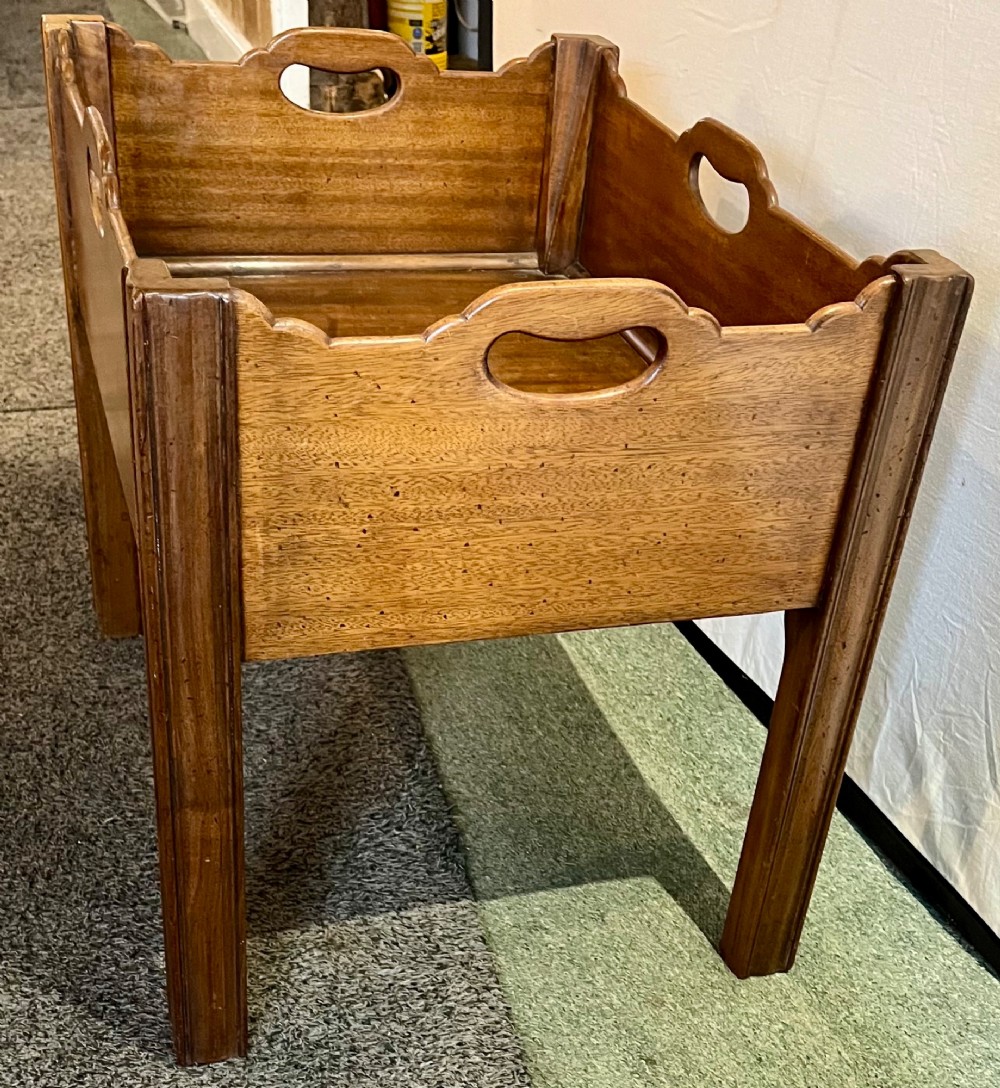 An early 20th-century mahogany low table featuring a raised gallery rim with integrated hand-holds and reeded square legs. View IV