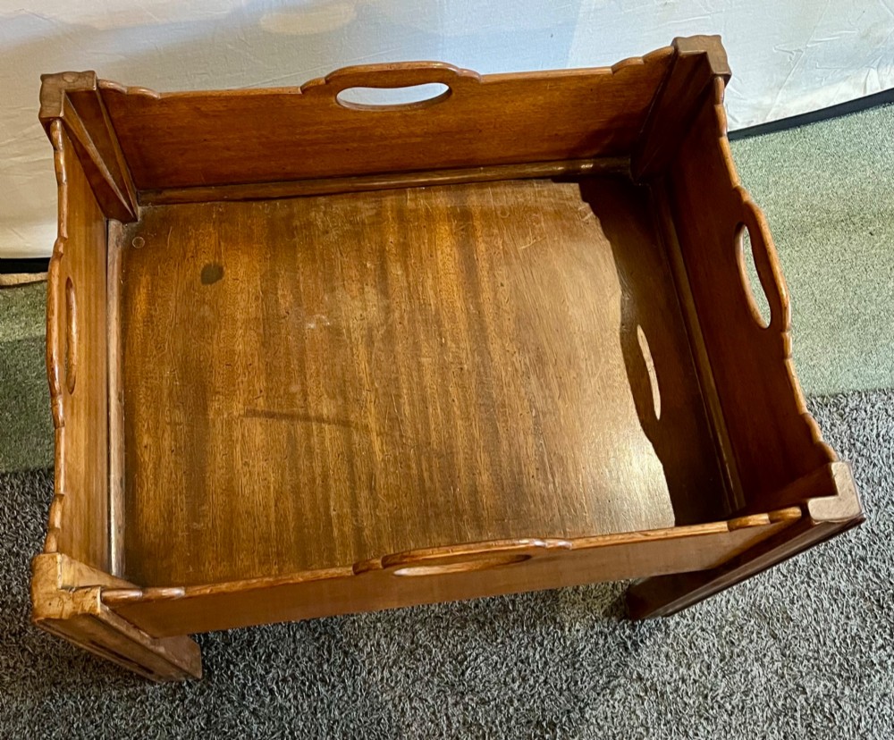 An early 20th-century mahogany low table featuring a raised gallery rim with integrated hand-holds and reeded square legs. View VII
