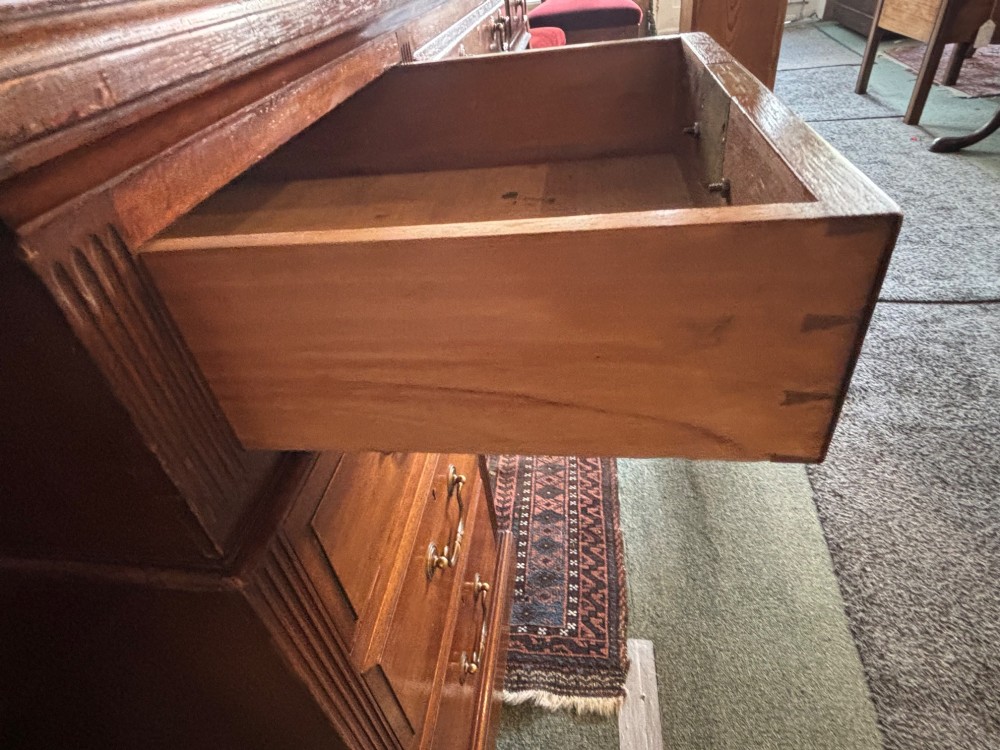 A Victorian mahogany pedestal desk featuring nine drawers with brass swan-neck handles and fluted side columns. View VIII