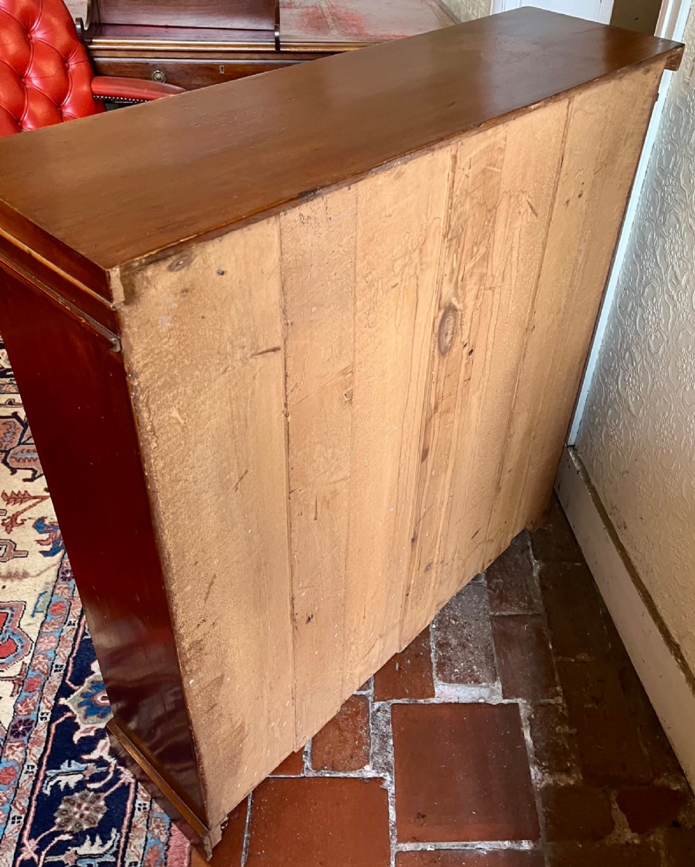 A Victorian open mahogany bookcase featuring three open timber shelves, a simple moulded top, and a plinth base. View VI