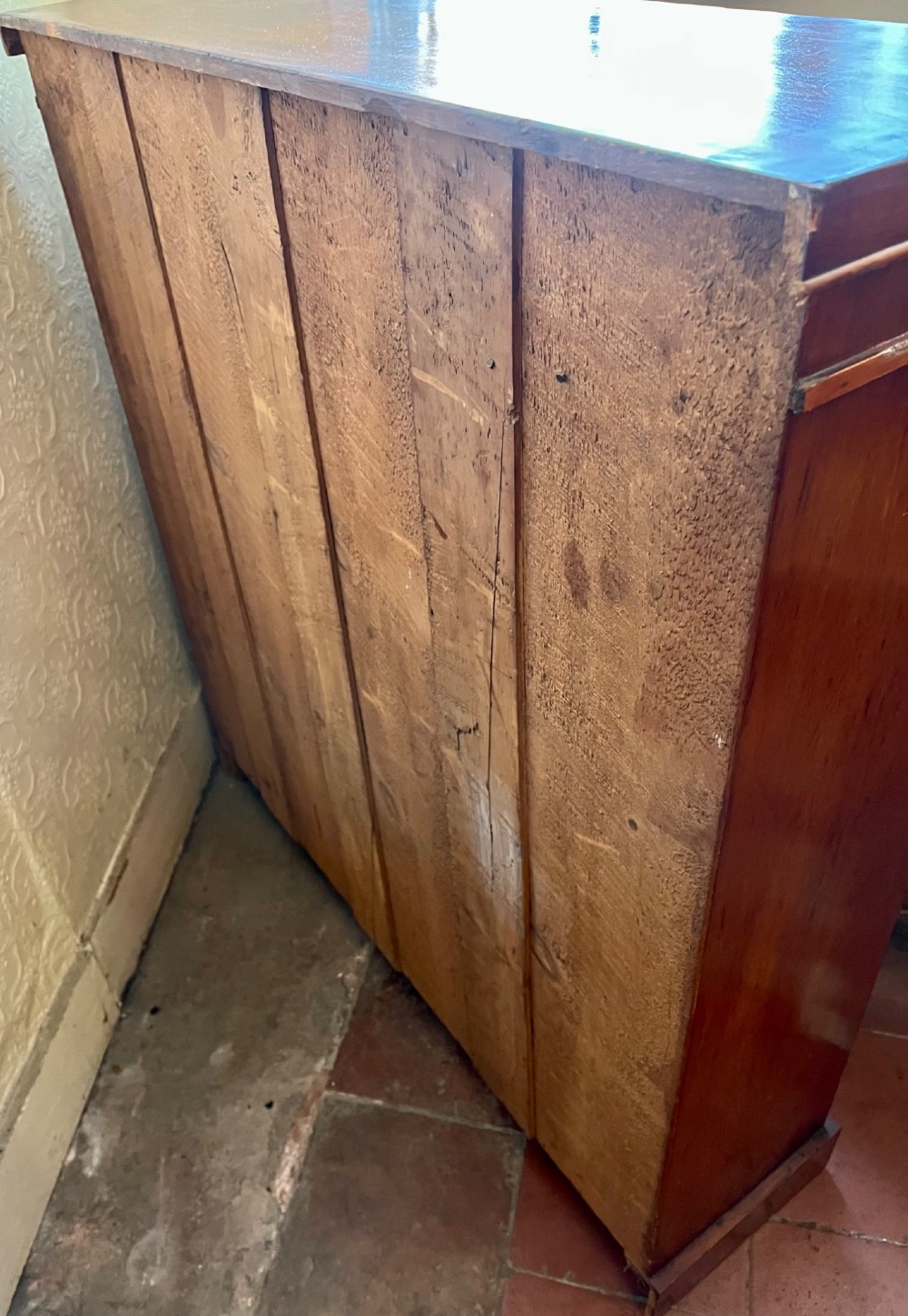 A low Victorian open mahogany bookcase featuring three wide shelves, exposed vertical backboards, a top edge, and a plinth base. View VIII