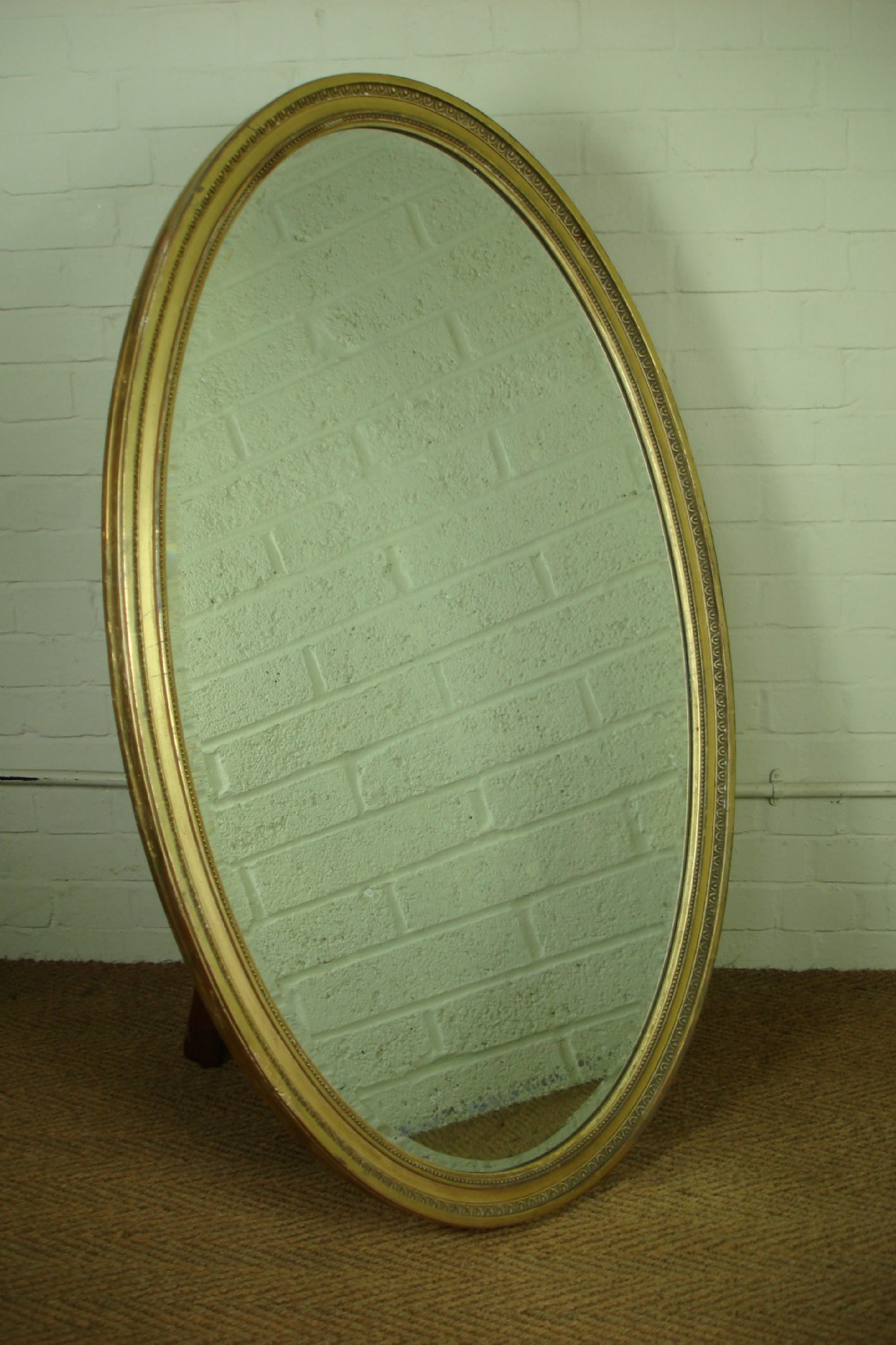 Large Victorian oval gilt mirror