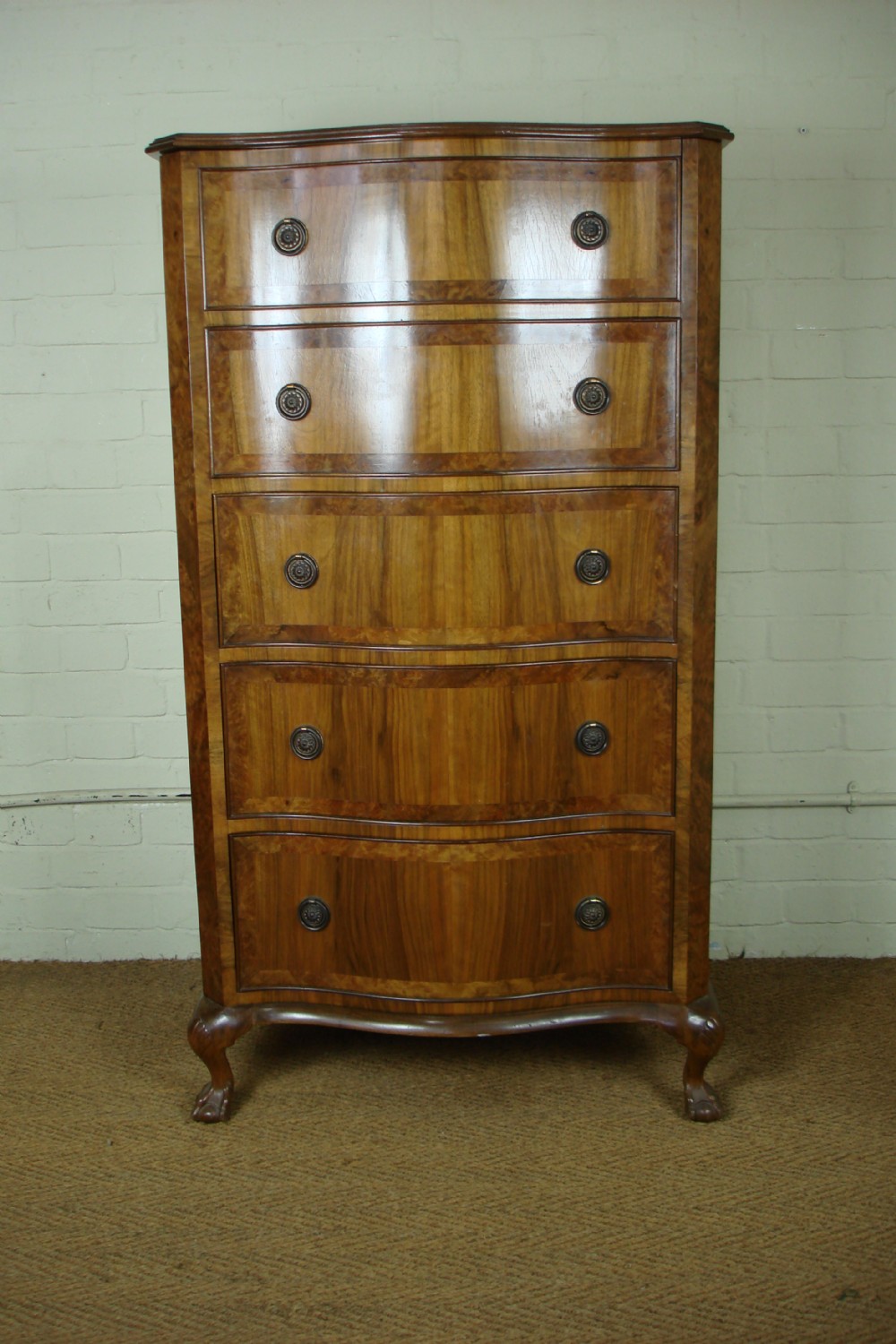 Serpentine walnut chest