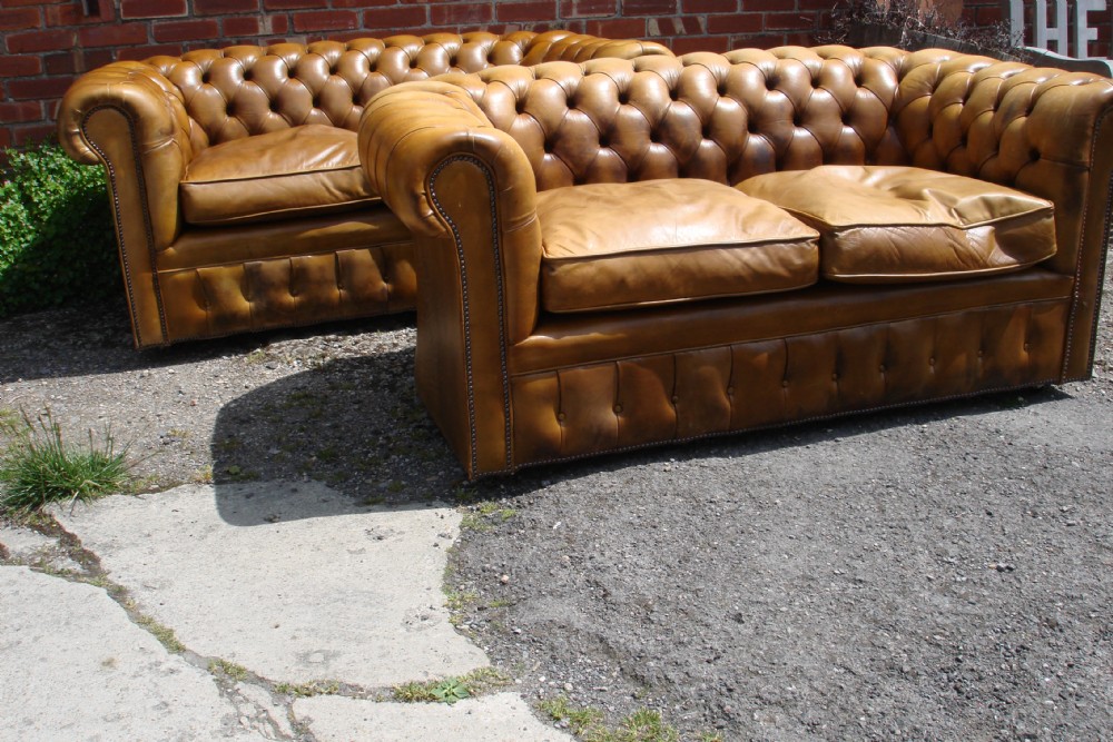 Pair of leather chesterfield sofas