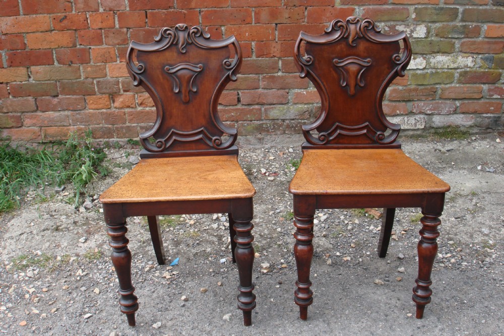 Pair of mahogany hall chairs