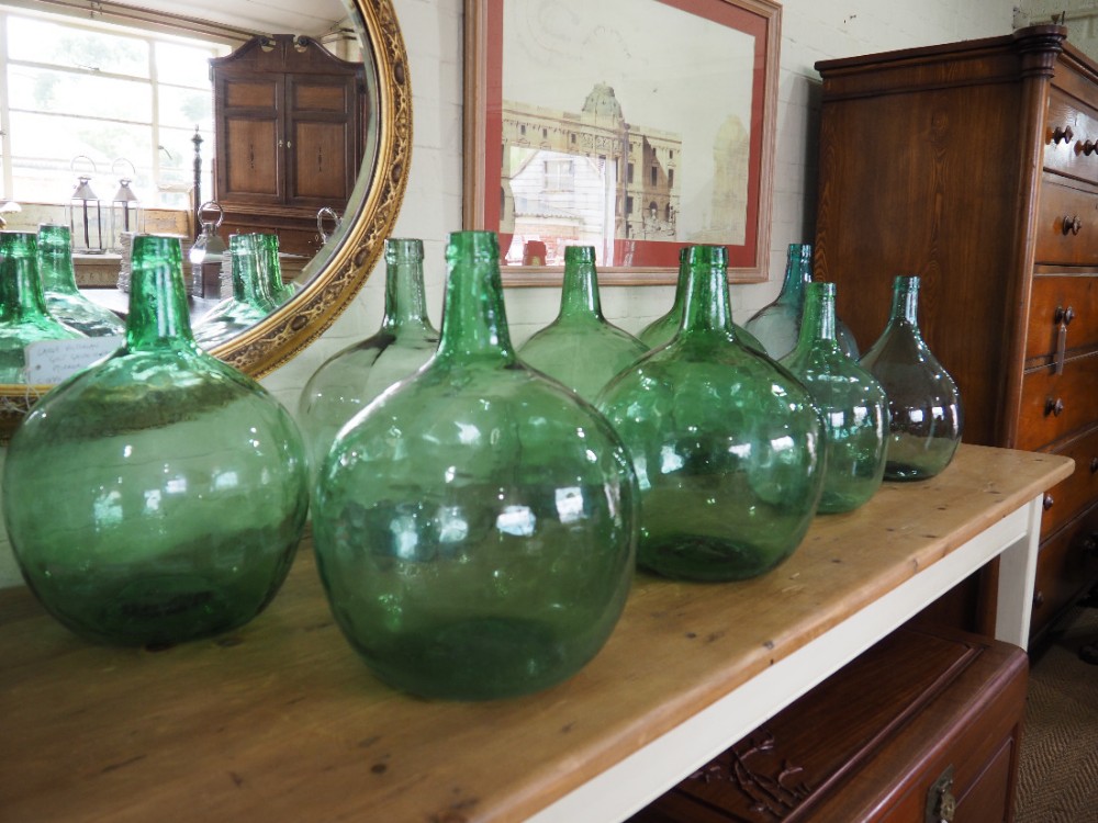 Group of nine glass carboys