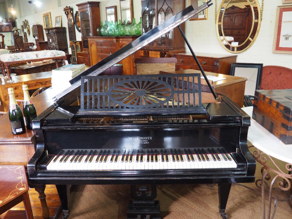 Ebonised baby grand piano