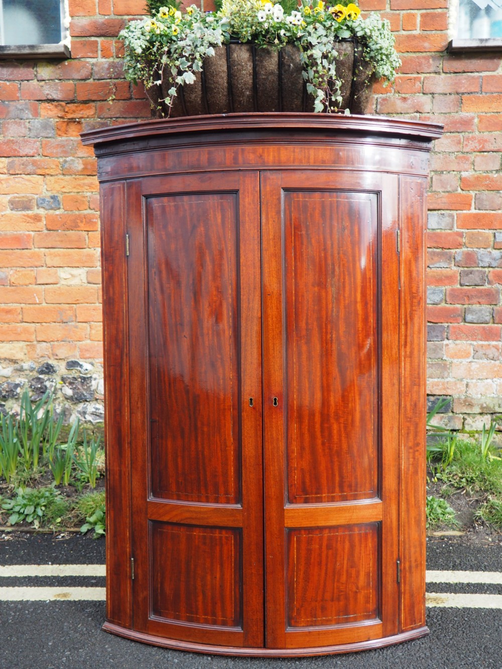 Georgian mahogany bowfronted hanging corner cupboard