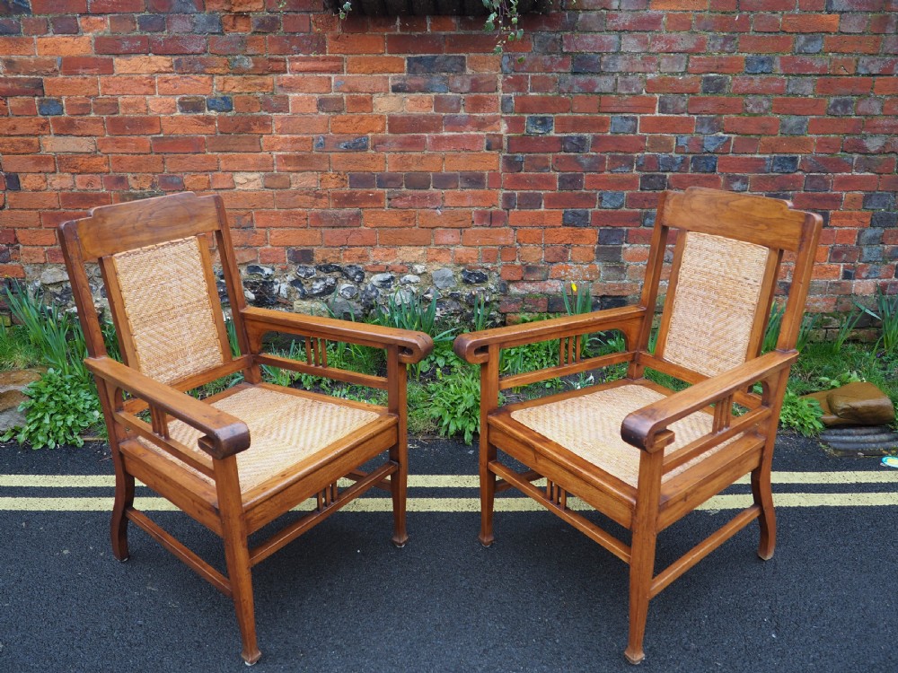 Pair of indian teak armchairs