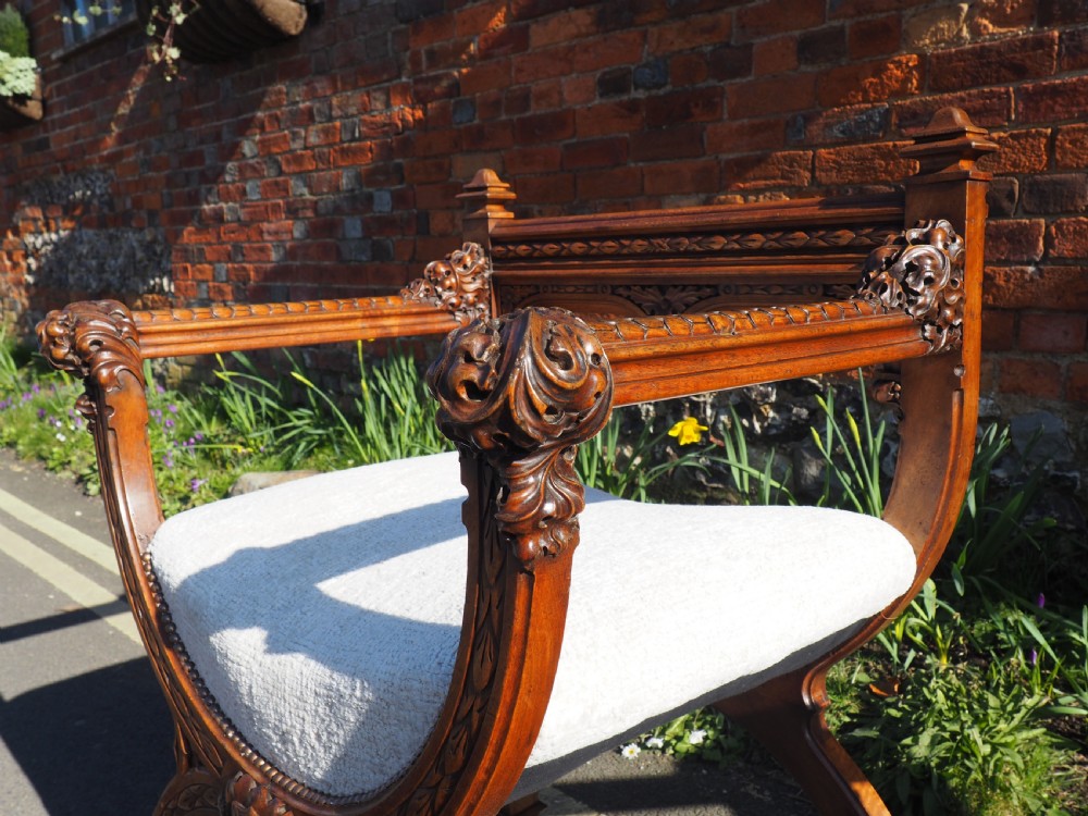 Pair of walnut savonarola chairs View XIX