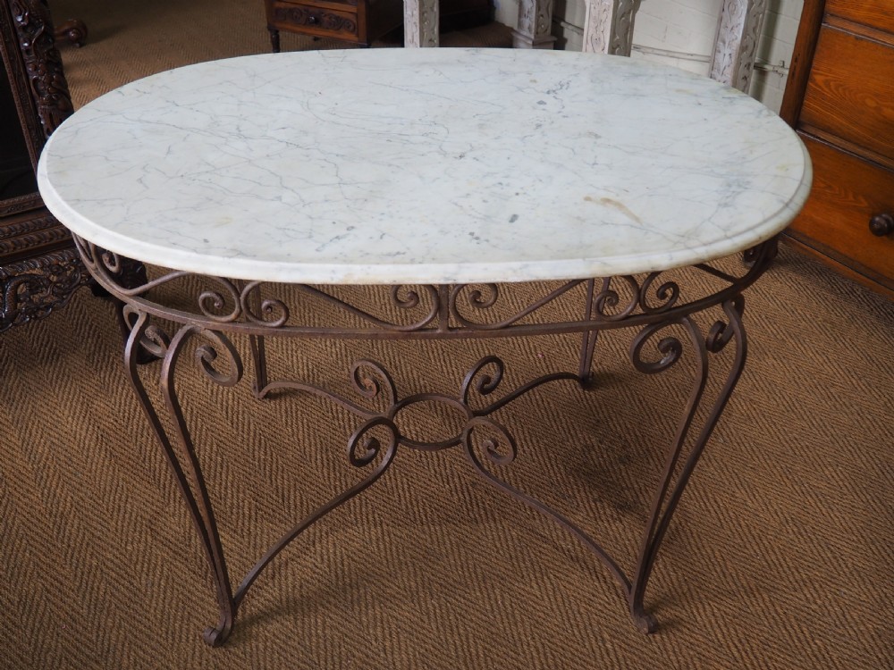 Wrought iron and marble table