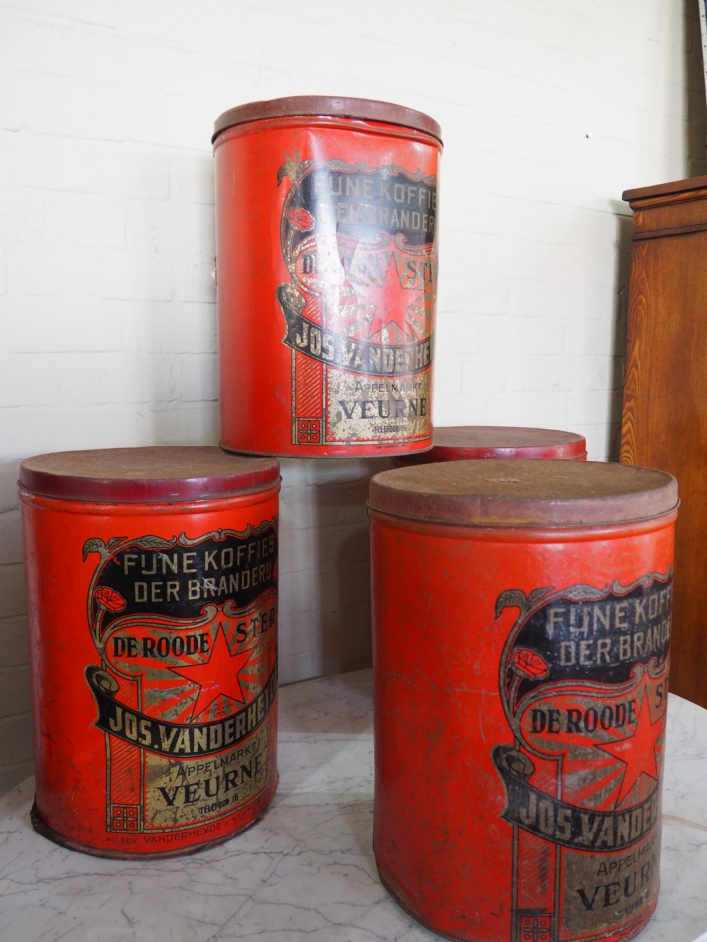 Group of four Belgian coffee canisters View II