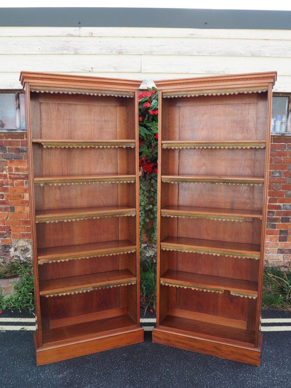 Pair of tall Walnut open Bookcases