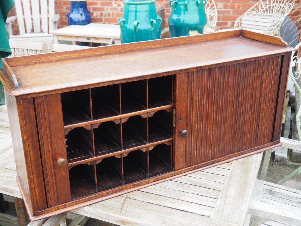 Oak tambour fronted cabinet