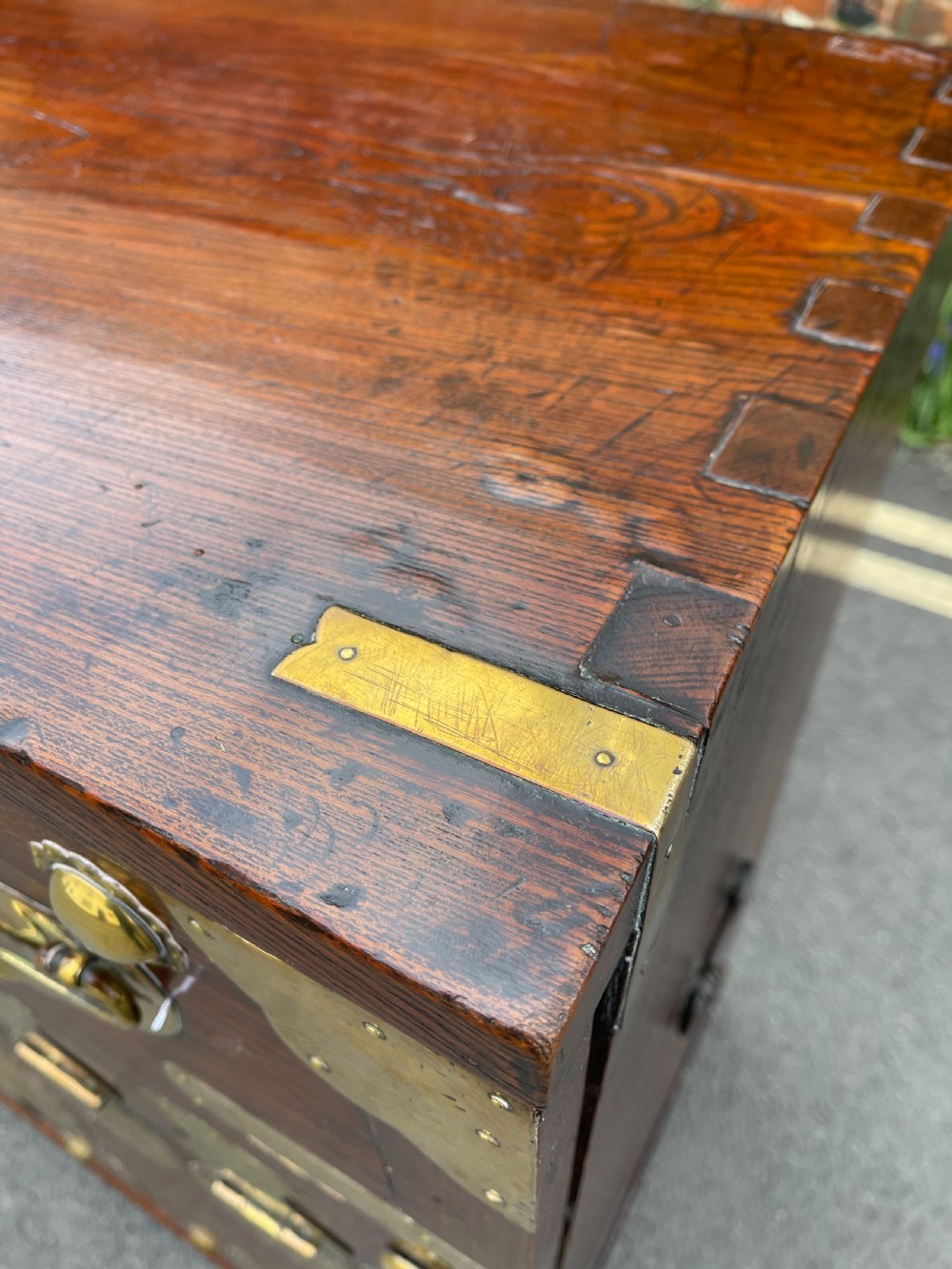 A traditional Korean elm wood Bandaji chest featuring decorative brass mounts, side handles, and a drop-front upper panel. View VI