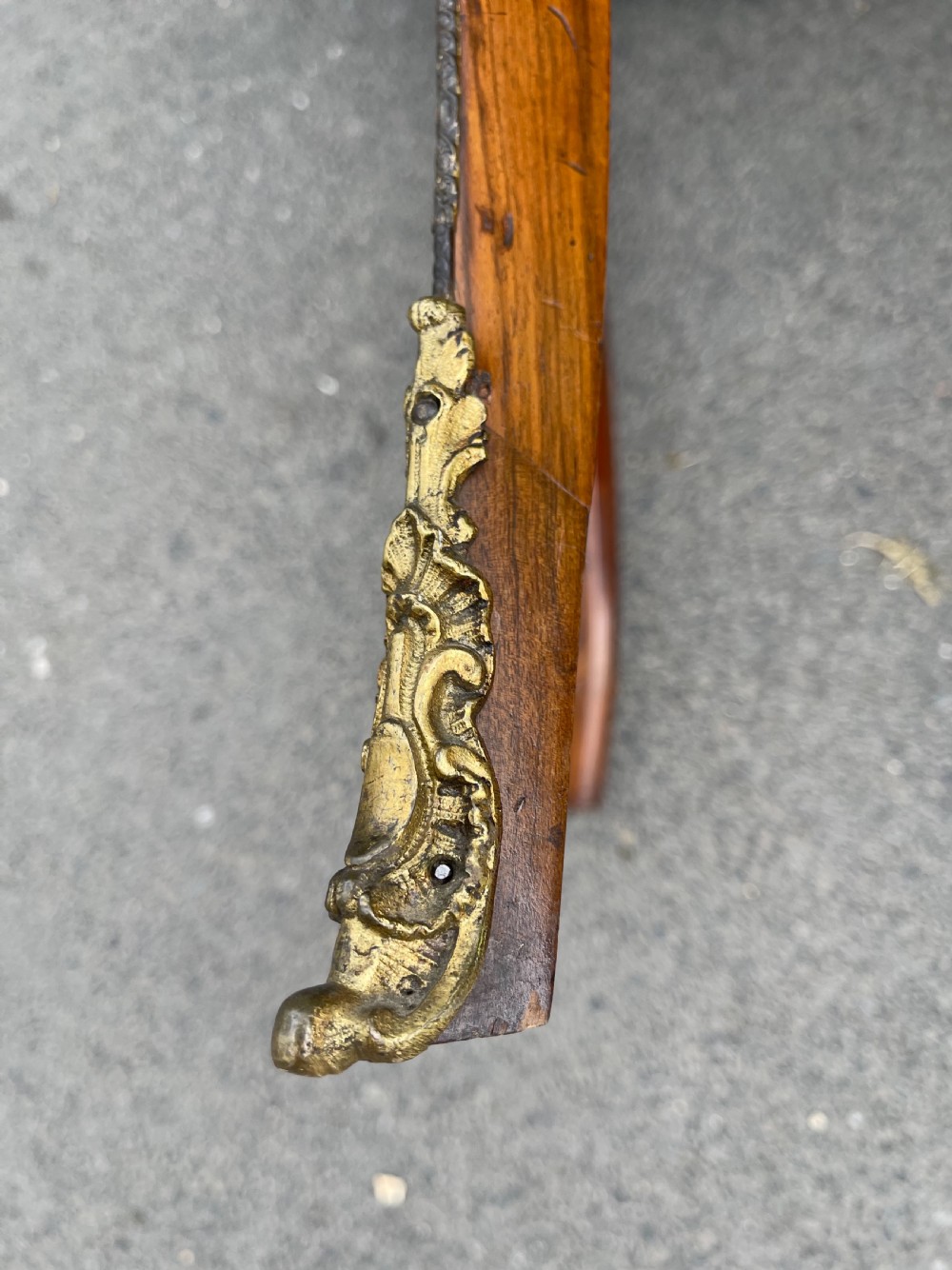 A 19th-century French style walnut centre table featuring a shaped serpentine top with floral marquetry inlay, slender cabriole legs, and ornate gilt bronze mounts. View III