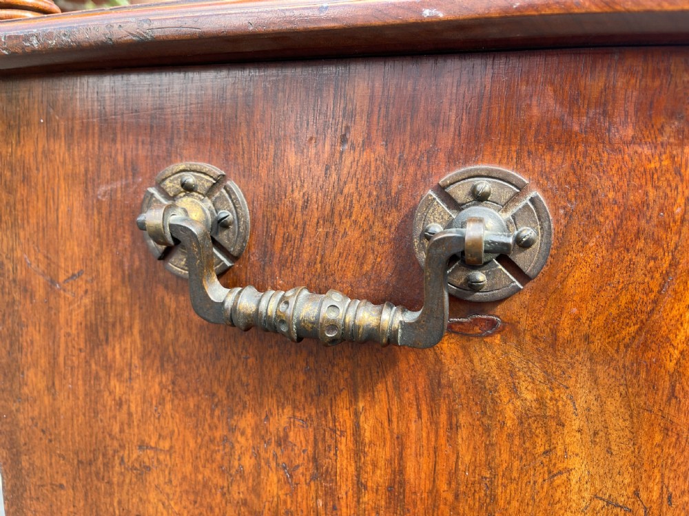 Victorian walnut purdonium featuring an upper shelf on turned spindles with a brass gallery above a carved drop-front compartment. View II