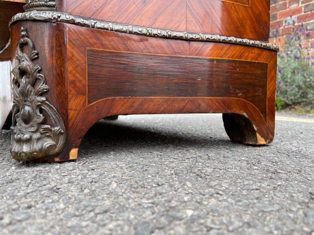 A tall, narrow 19th-century French rosewood semainier chest featuring seven drawers with floral marquetry inlay, bronze handles, and a marble top. View VIII