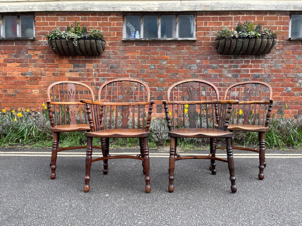 Set of four nineteenth century yew Windsor armchairs 