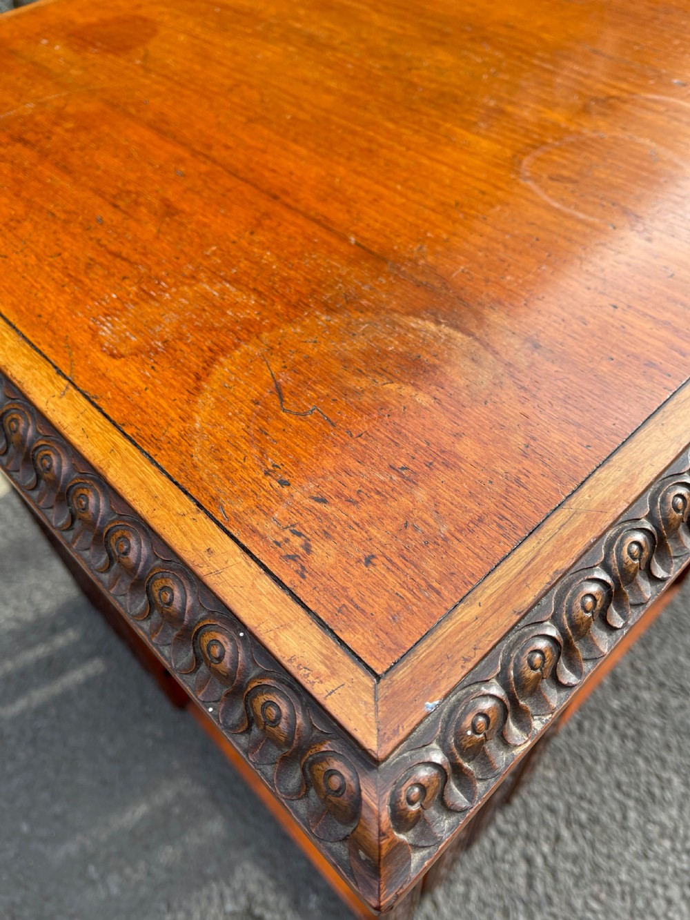 An Anglo-Indian carved wood revolving bookcase featuring vertical foliate slats and a tiered pedestal base. View III