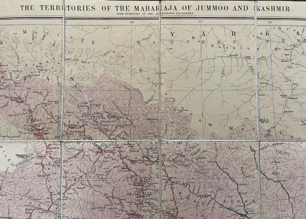 An antique terracotta cloth-bound cover for Thackers Map of Jummoo and Kashmir featuring gilt-embossed lettering and a debossed border. View III