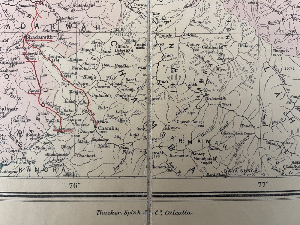 An antique terracotta cloth-bound cover for Thackers Map of Jummoo and Kashmir featuring gilt-embossed lettering and a debossed border. View IV