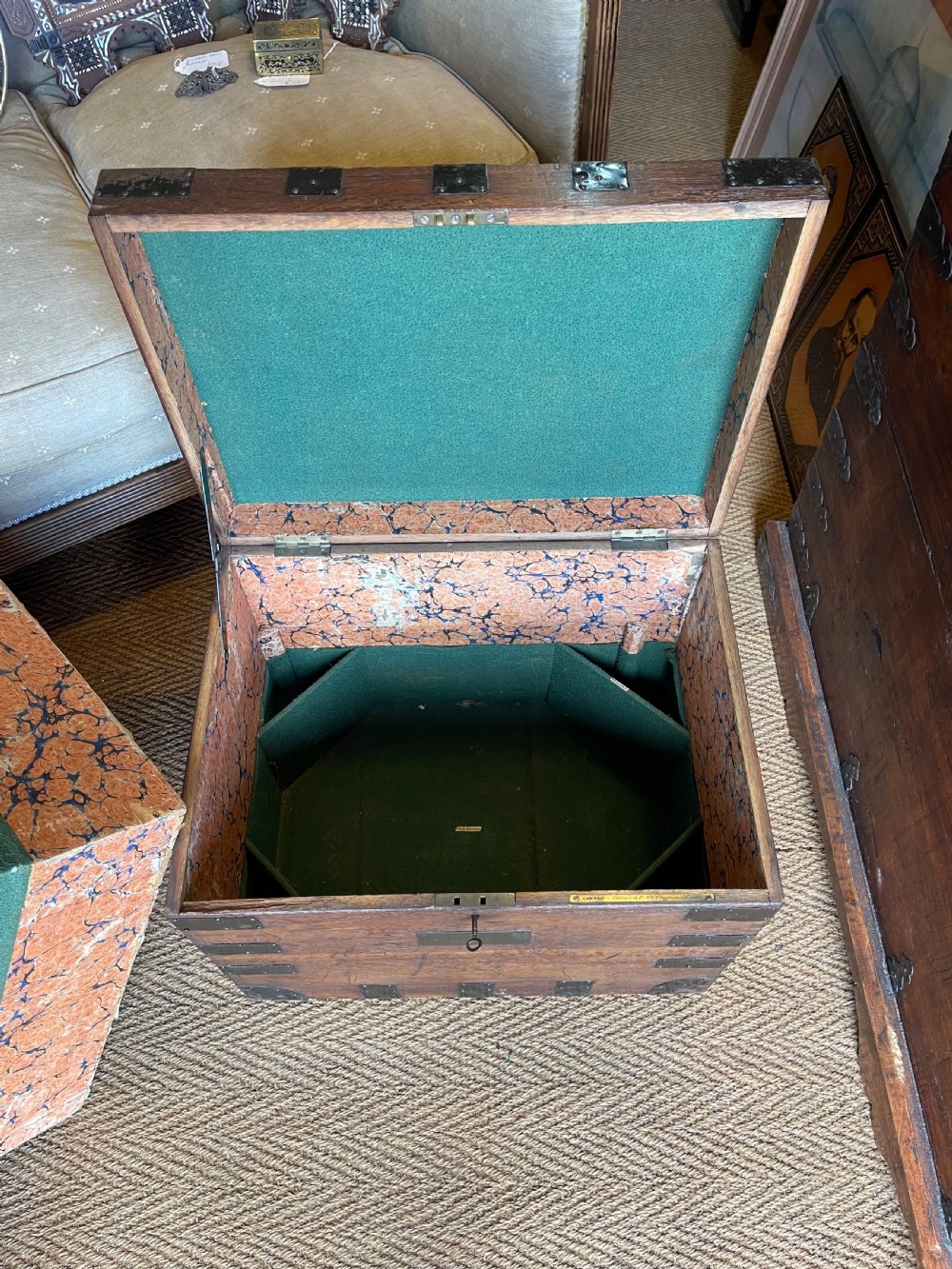 A nineteenth-century oak silver chest featuring metal corner brackets, iron strap bindings, and a central brass plate. View III