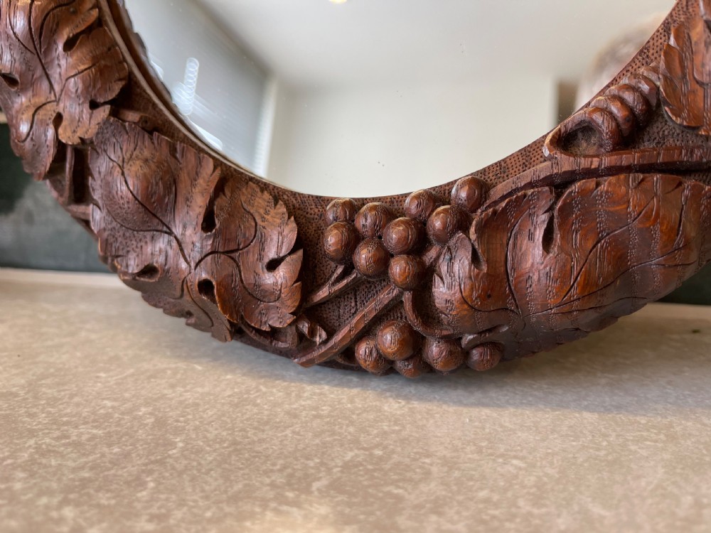 Pair of small carved oak mirrors  View II