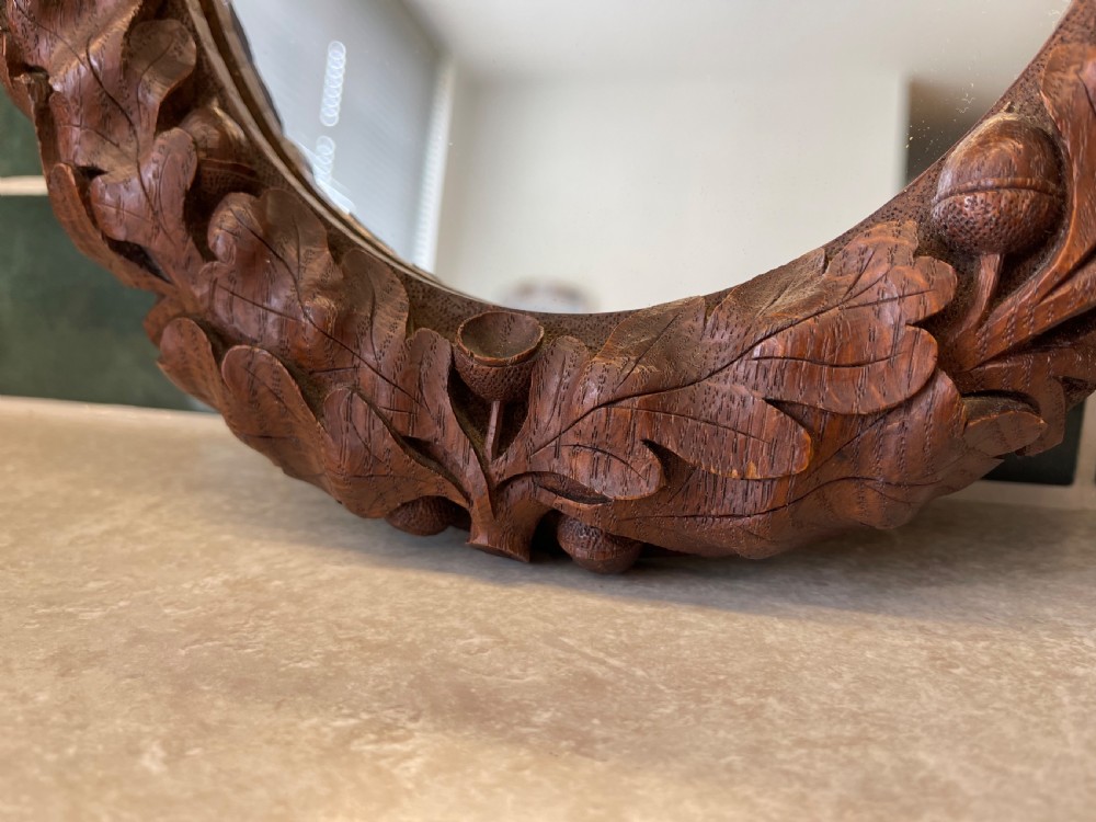 Pair of small carved oak mirrors  View III