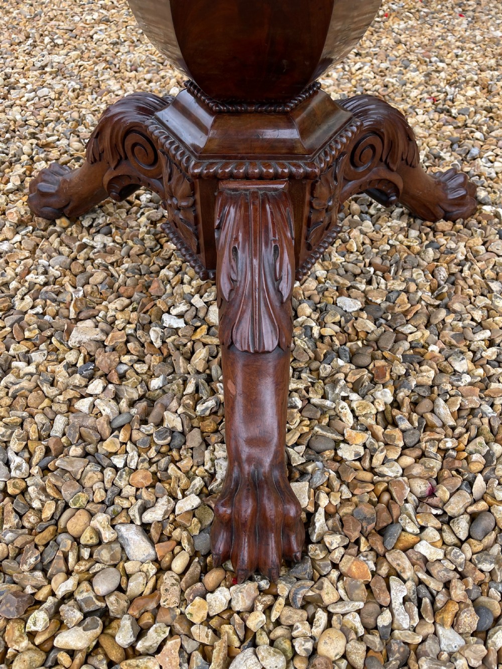 A circular nineteenth-century mahogany centre table featuring a geometric specimen marble mosaic top bordered by a Greek key pattern, supported by a carved pedestal base. View II