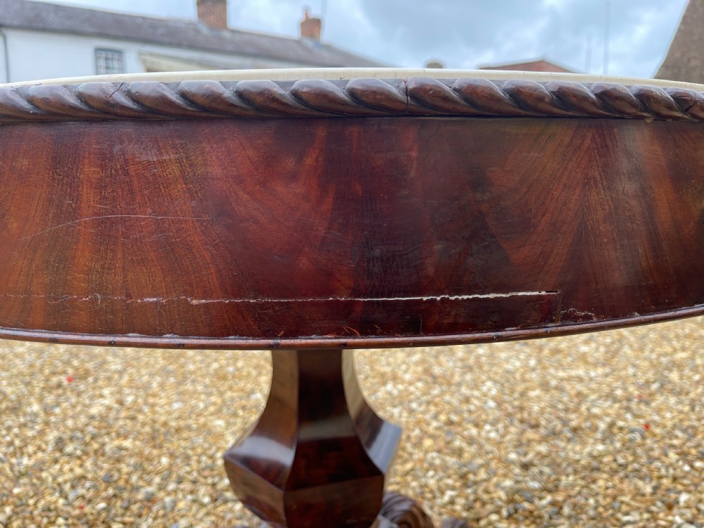 A circular nineteenth-century mahogany centre table featuring a geometric specimen marble mosaic top bordered by a Greek key pattern, supported by a carved pedestal base. View VIII