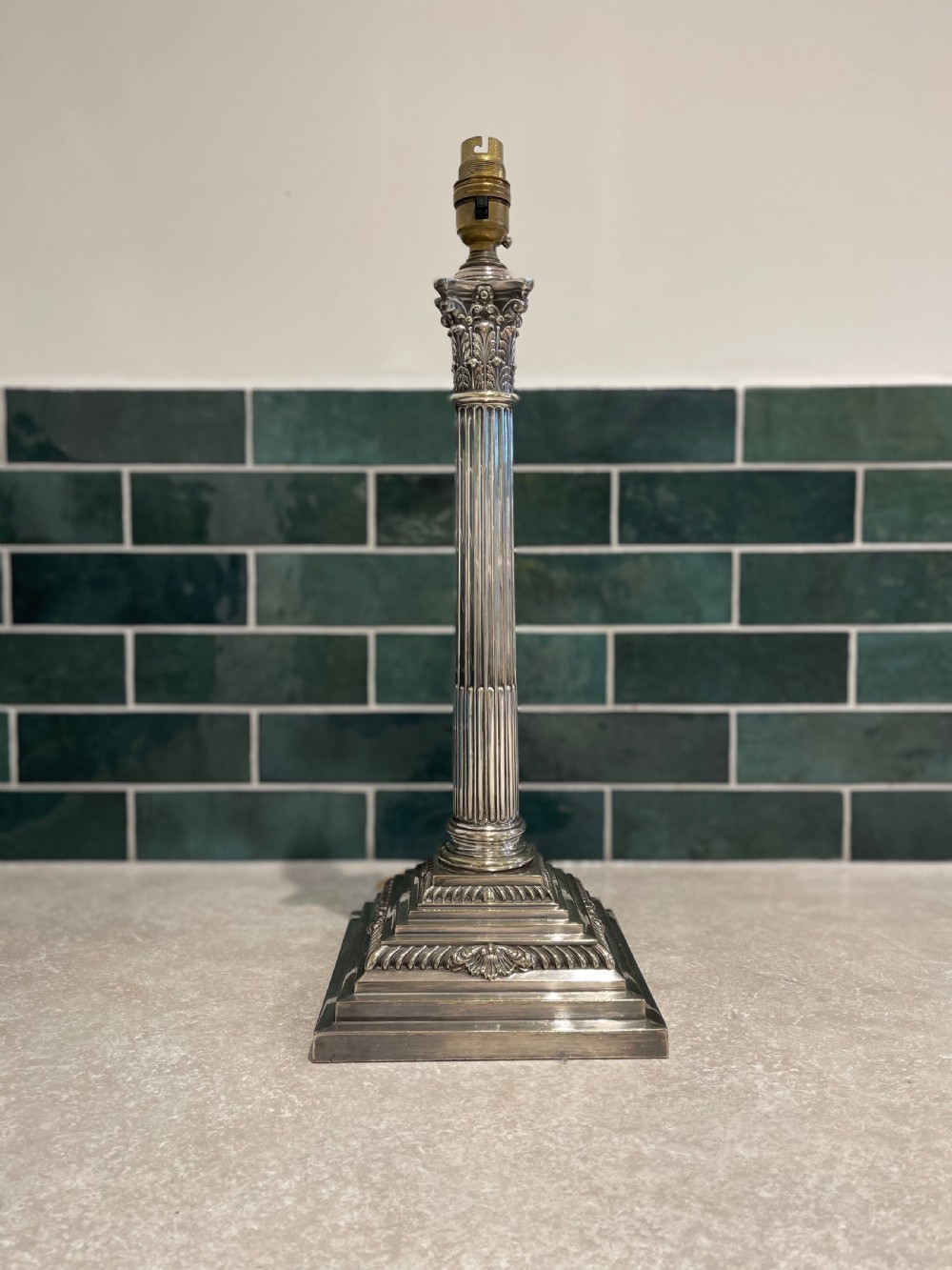 Silver plated Corinthian column lamp. 
